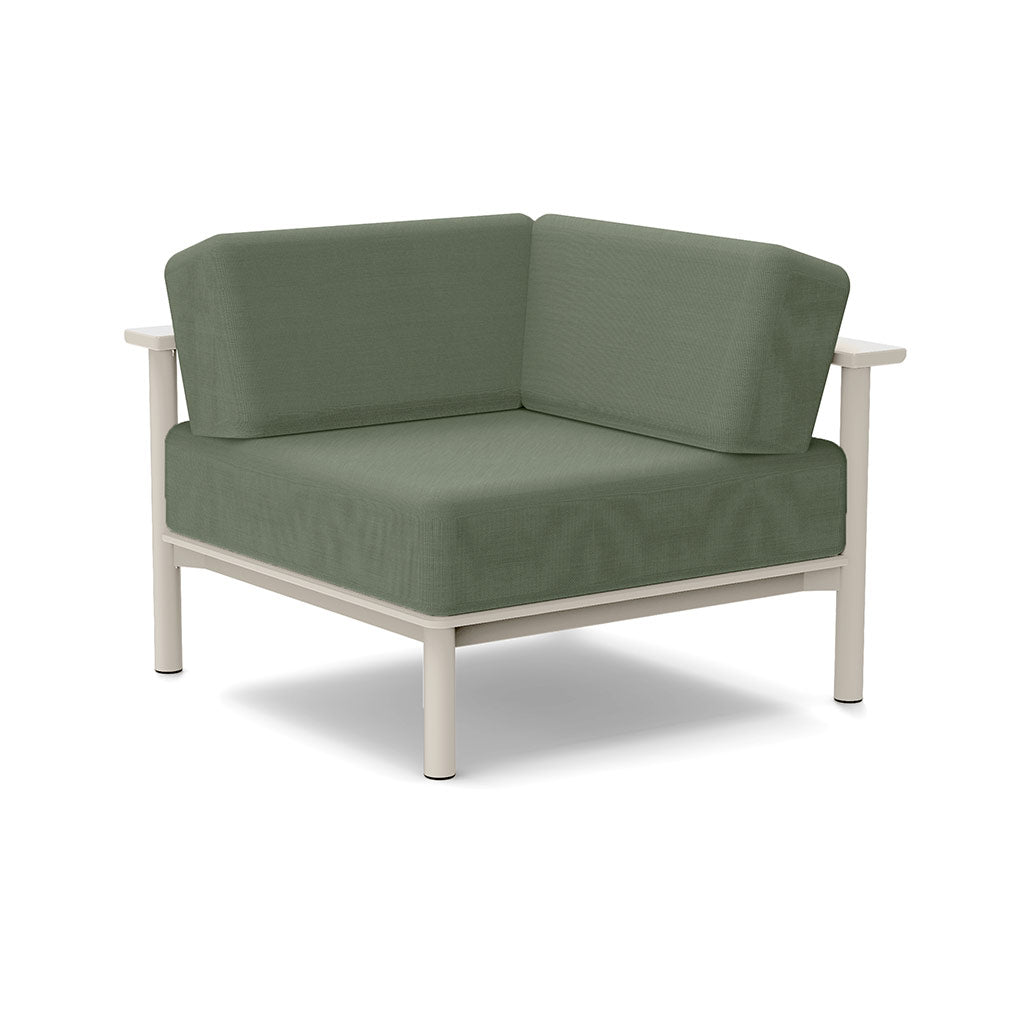 Studio image of a Corner Lounge Chair with Fog frame and Fern cushions.