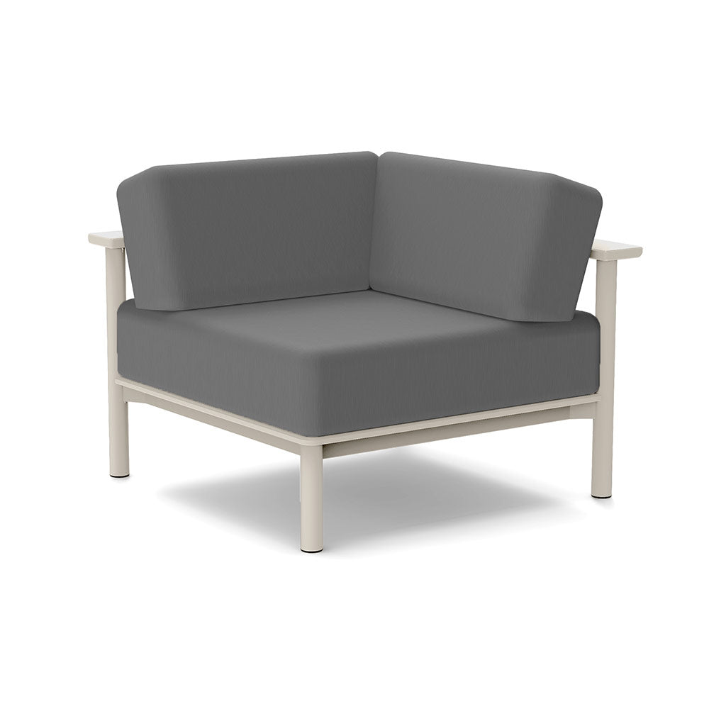 Studio image of a Corner Lounge Chair with Fog frame and Charcoal cushions.