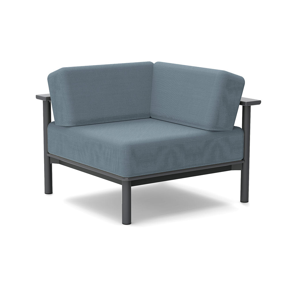 Studio image of a Corner Lounge Chair with Charcoal frame and Haze cushions.