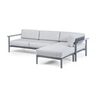Aurora configuration set up in an "L" with a Right Arm Sofa, Corner Lounge, and Ottoman with Charcoal frame and Cloud cushions. 