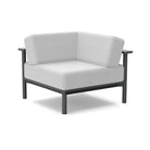 studio image of aurora corner lounge chair with grey frame and cloud cushions.