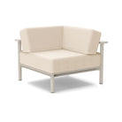 Studio image of a Corner Lounge Chair with Fog frame and Flax cushions.