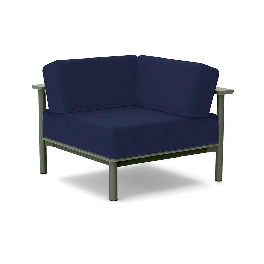 Studio image of a Corner Lounge Chair with Sage frame and Navy cushions.
