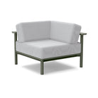 Studio image of a Corner Lounge Chair with Sage frame and Silver cushions.