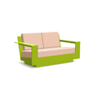 studio shot of nisswa loveseat in leaf green with cast petal cushion