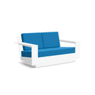 studio shot of nisswa loveseat in white with regatta blue cushion